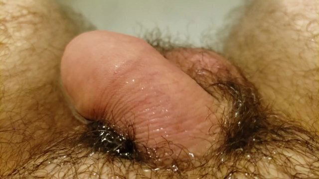 Close small limp penis while taking bath