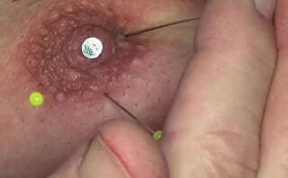 nail and pins in playerdoi'_s tit