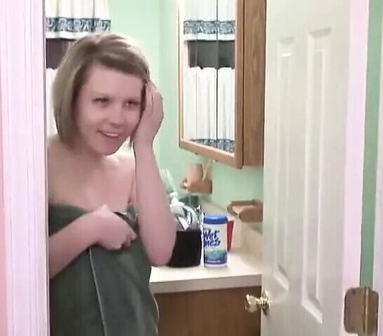 Cute blonde masturbates shower