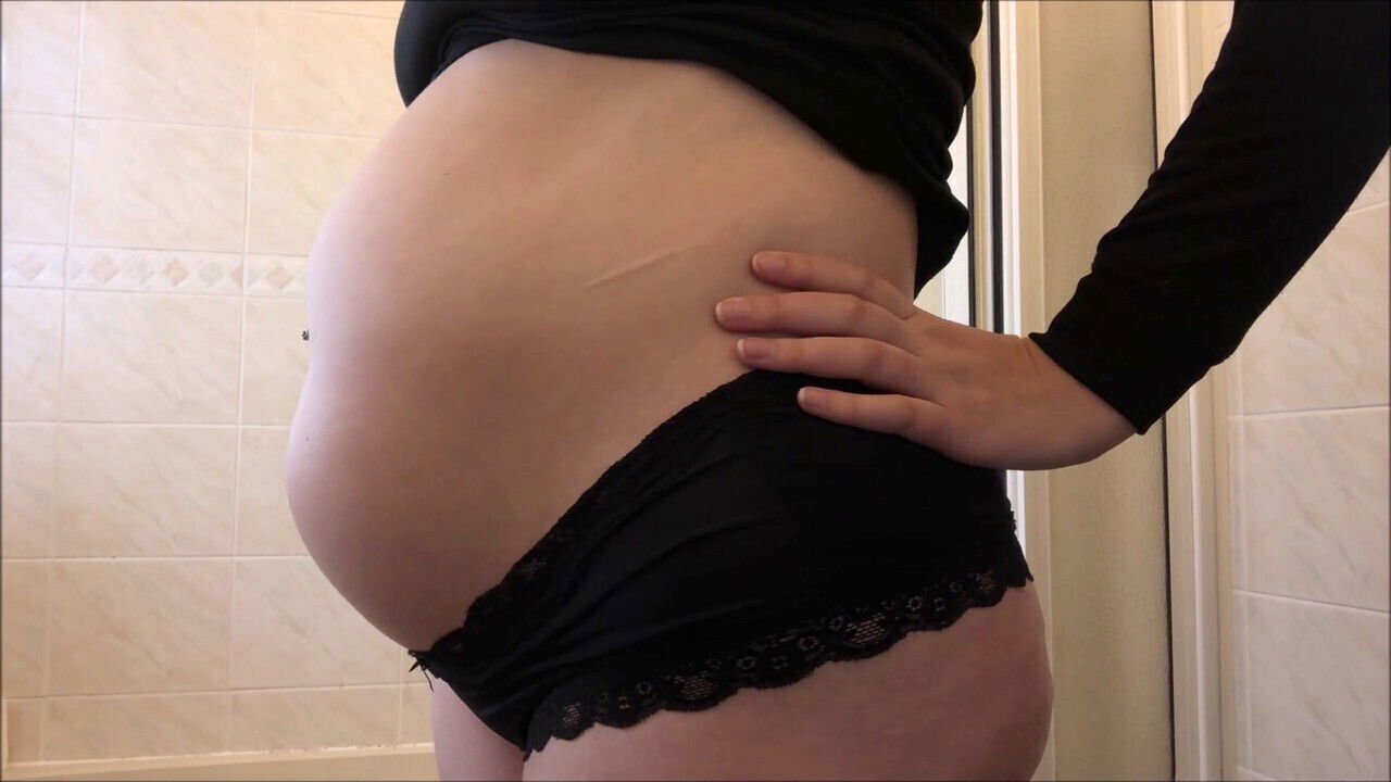 Bloated babe's massive water belly inflation stomach enthusiasts