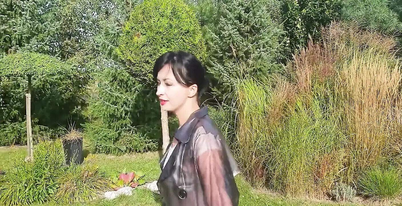 Garden, beautiful sunny day. Wanilianna transparent raincoat, black seamed nylons