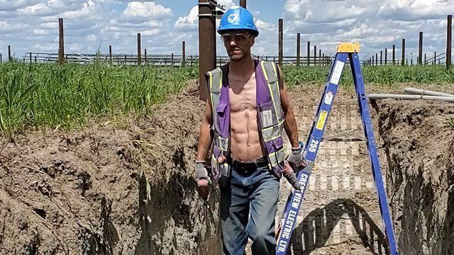 Sexy Shirtless Electrician Laying Pipe For Solar Farm