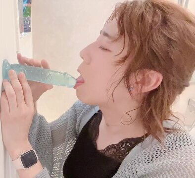 very pretty beautiful woman performs fellatio with dildo.