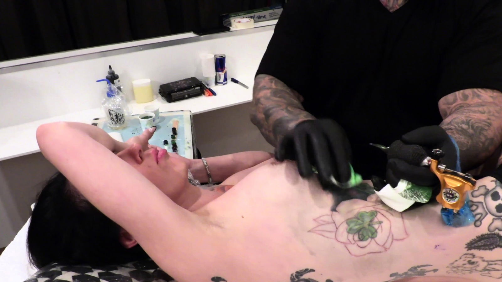 Marie Bossette gets rose tattooed