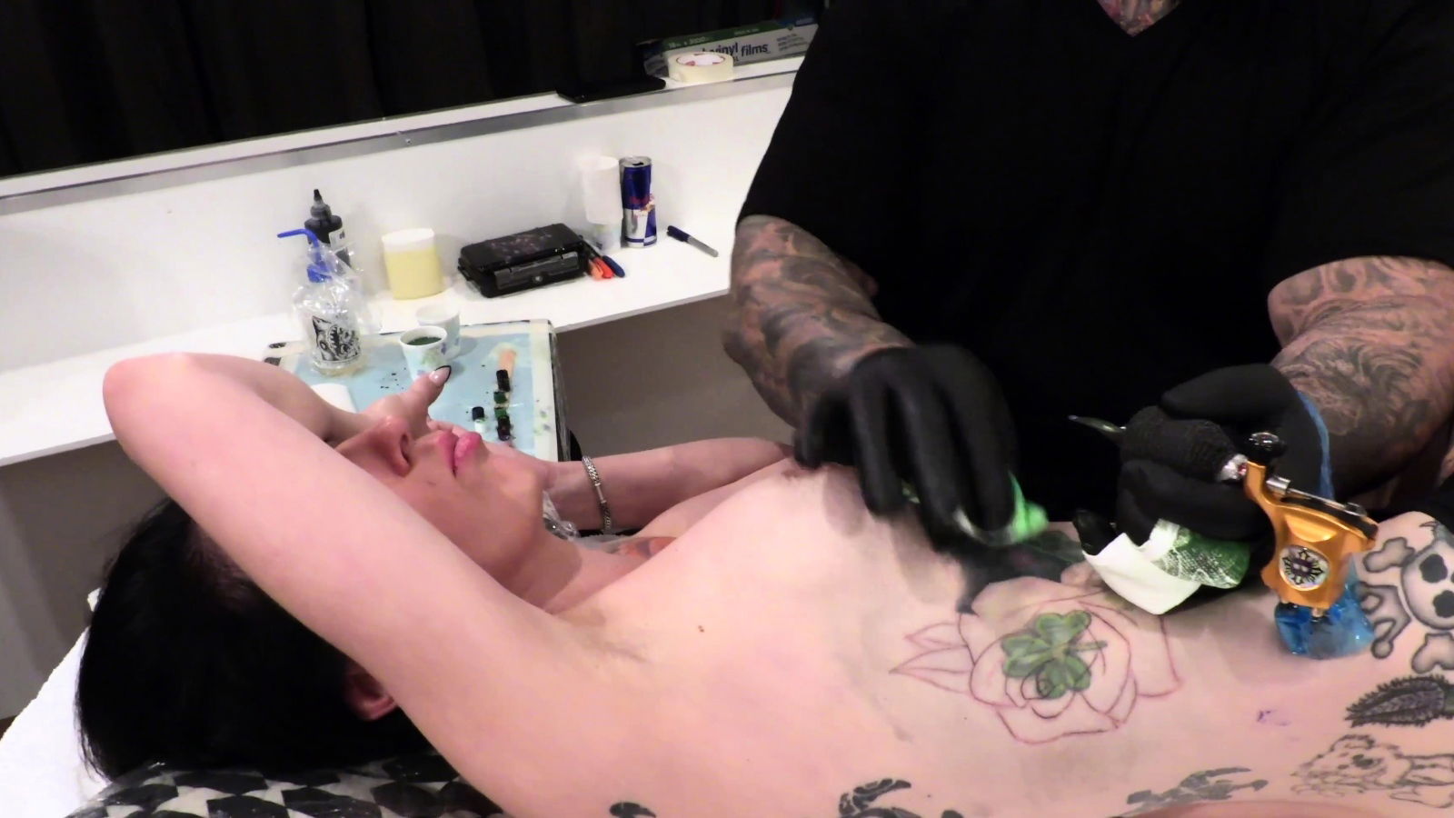 Marie Bossette gets rose tattooed