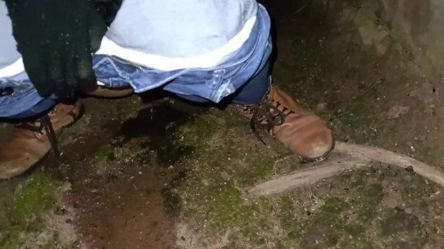 Couple peeing having public behind church