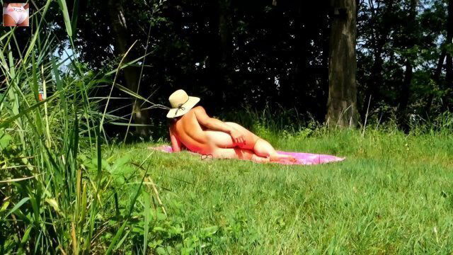 Sexy girl sensual massage body after sunbathing naked garden (TRAILER 