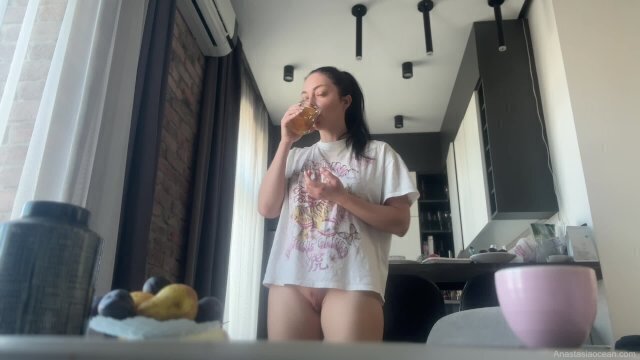 Sexy brunette does housework without panties.