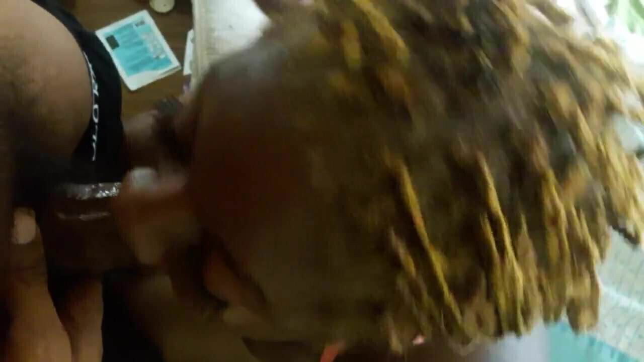 Black MILF giving head
