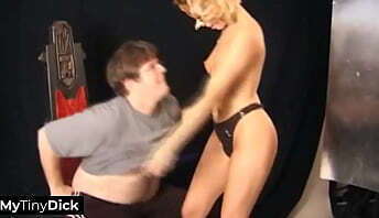 A sexy blonde is sucking his small, pathetic dick