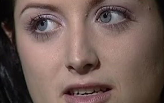 Booth sleight-of-hand performer from trade fair tepmts pretty young brunette