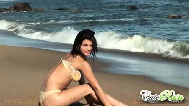 Cute rain teasing beach