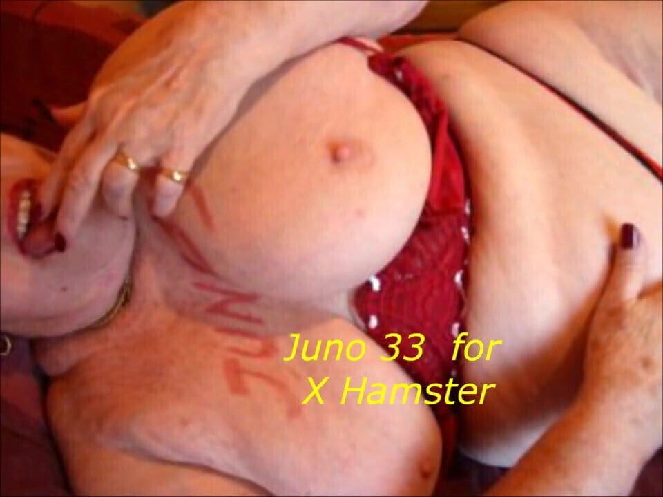 Granny on bed caressing her big tities