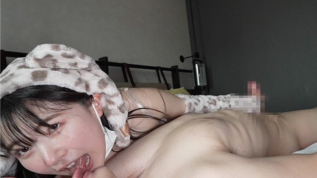 Japanese girls leopard costume gives handjob while French kissing.