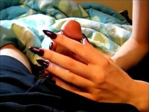 Long black nails playing with a cock