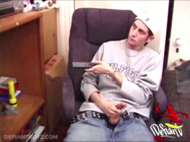 While watching porn movie, young amateur Aaron Michaels strokes himself hard then pulls jeans. After good stroke, frees himself splashes bed.