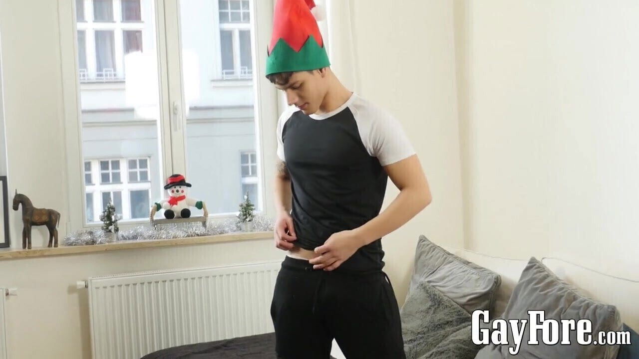 Handsome young homosexual spanks trimmed dick