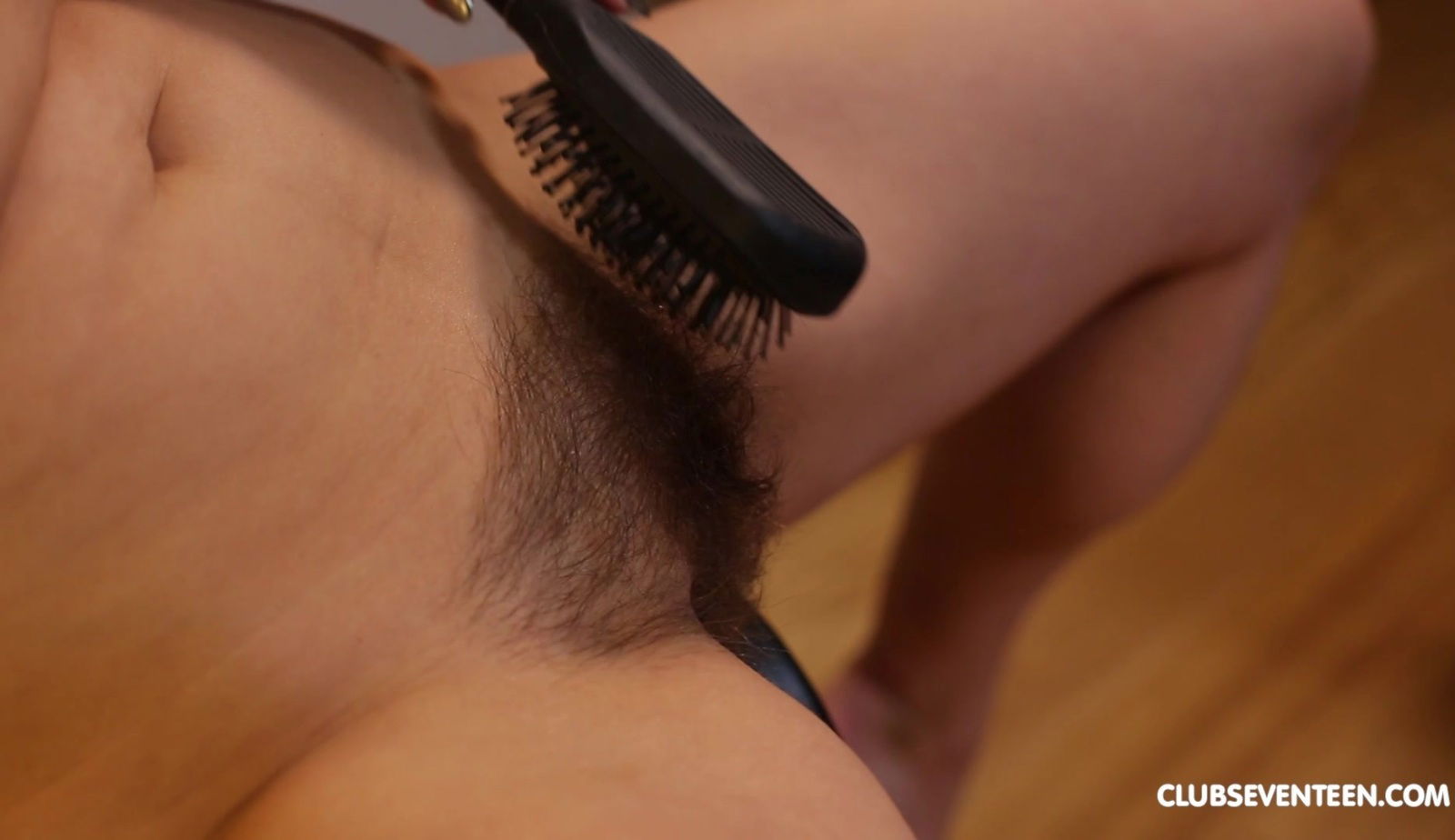 Erika Korti spreads legs plays with hairy muff