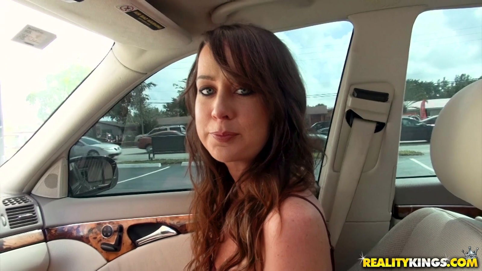 Brunette Chasity Greene kneeling playing with stiff