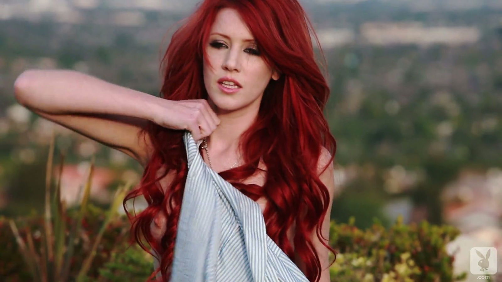 Redhead Alexandra shows pink pussy outdoors