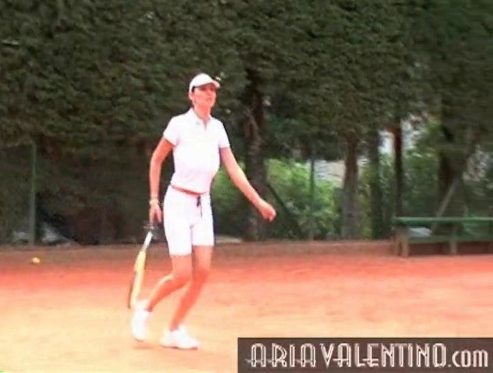 Valentino plays tennis outdoors