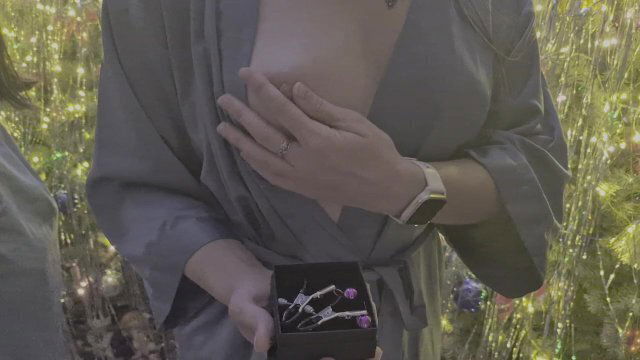 Year's gift. Girl plays with nipples