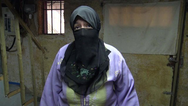 IRAQI WOMAN ROUGH WITH SOLDIER