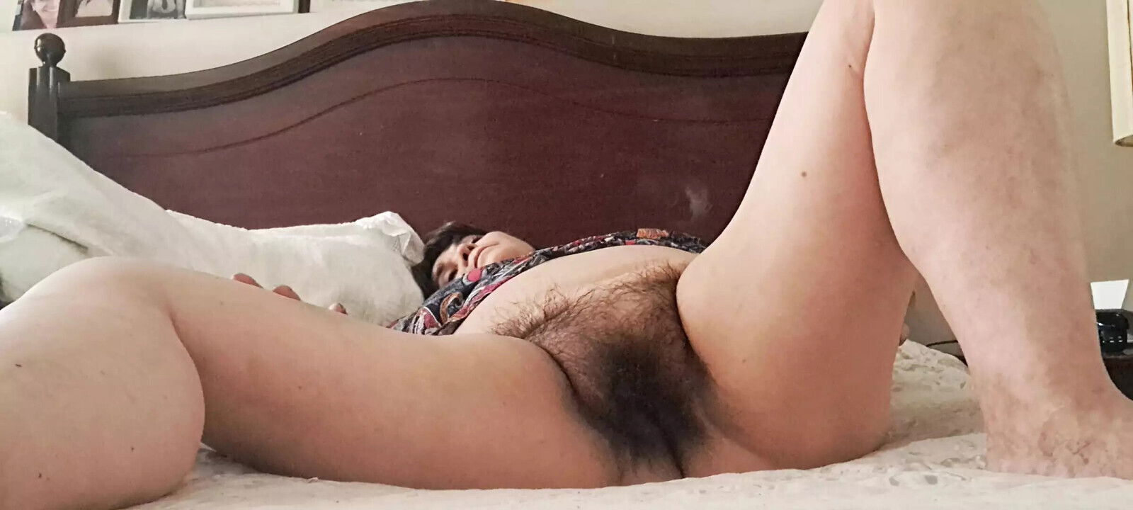 Mature milf showing puckered hairy pussy