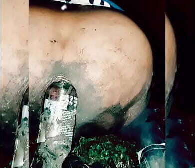 Slutty transvestite wallowing mud, putting bottles