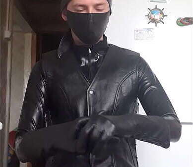 leather jacket putting gloves