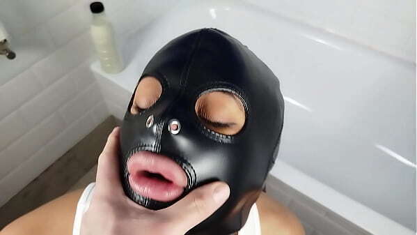Pervert bitch sucks bathtub fuck face with leather slave mask