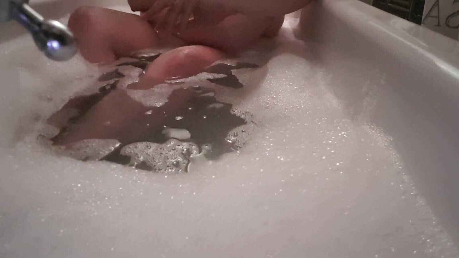 Amateur masturbates with suction dildo bath