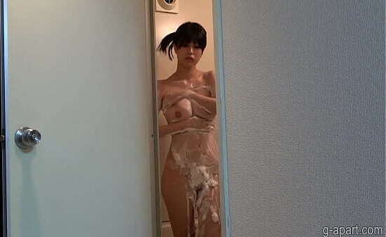 Japanese girl washes with soap takes shower