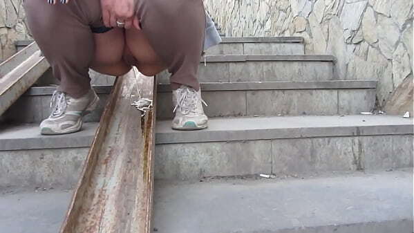 Public piss. Milf loves urinates stairs outdoors. Amateur fetish.