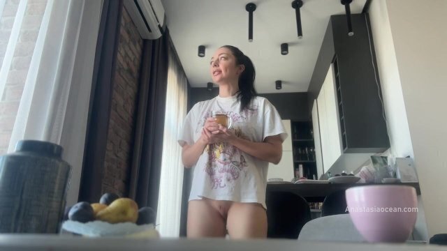 Sexy brunette does housework without panties.