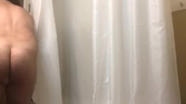 Showering fashioned wearing Mardi Gras beads