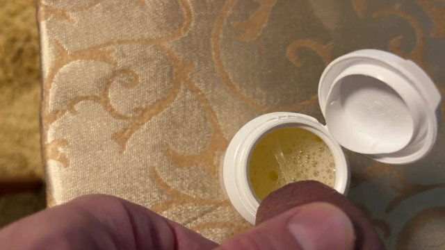 Earl relieves himself white container