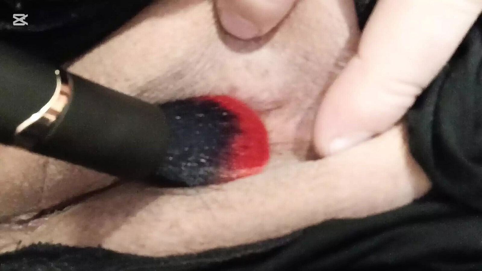 Tickling clitoris with brush