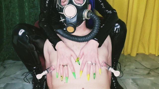 Slave mask. Fetish. Pumping male nipples, playing with nipples