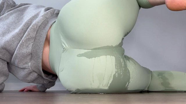 Girl laying floor herself yoga pants