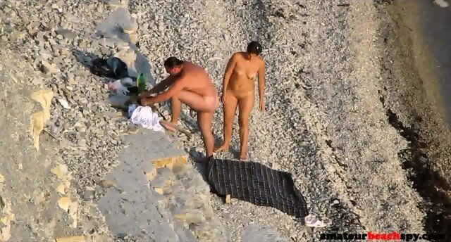 Voyeur beach couple enjoying