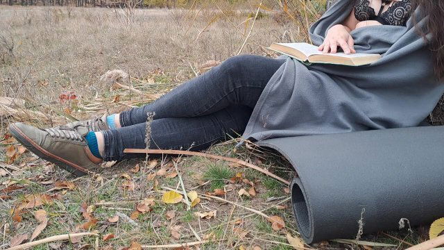 Romantic. Girl reading book park