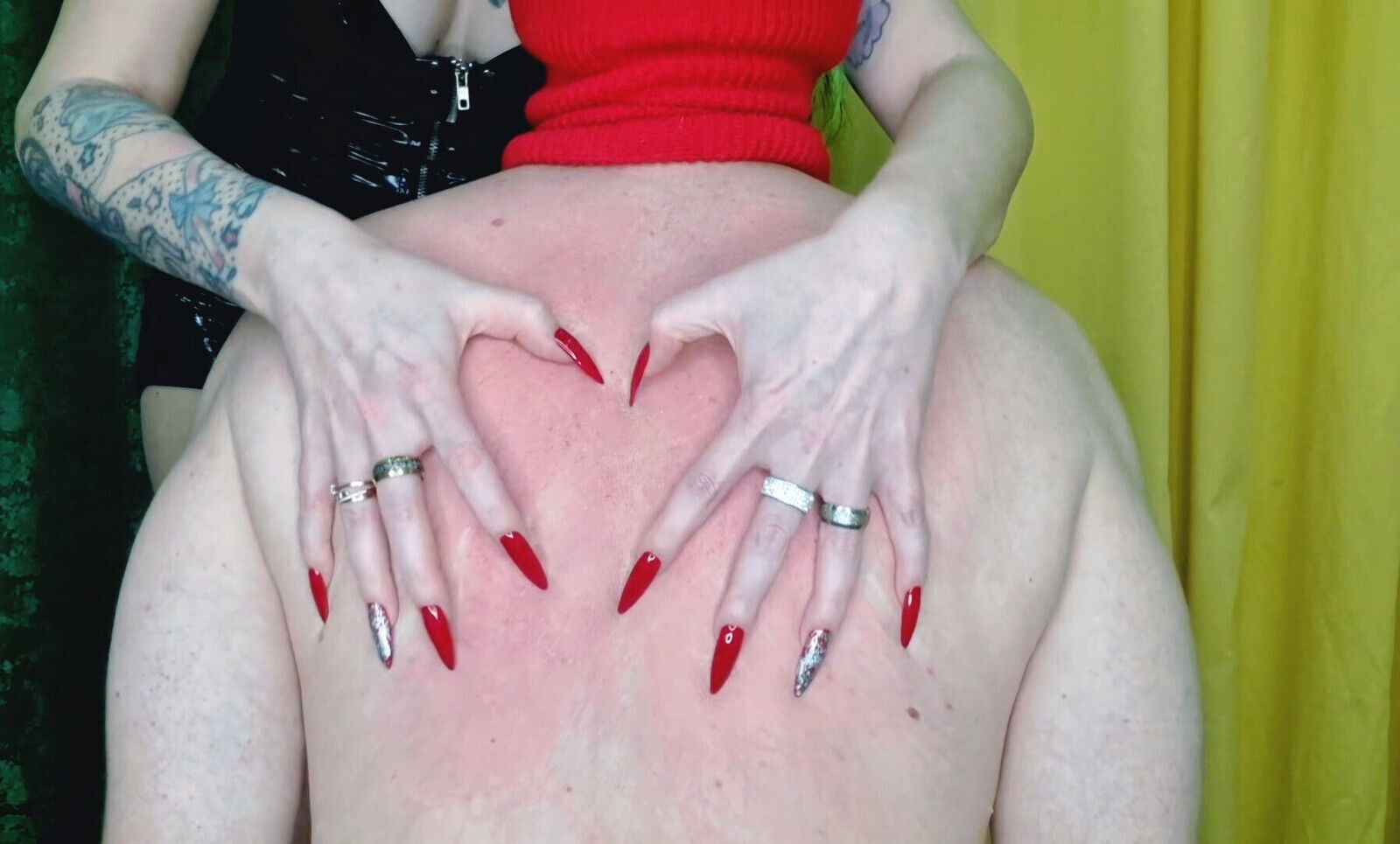 Fetish long sharp nails. Dominatrix scratches slave's back.