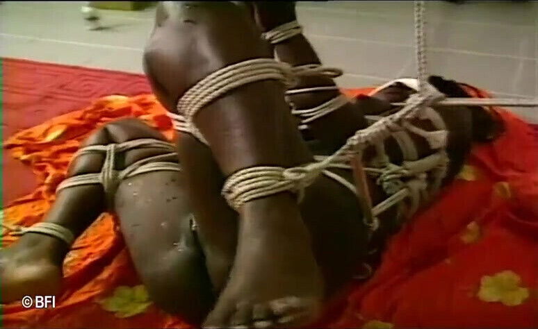 Ebony whore gets bound with ropes