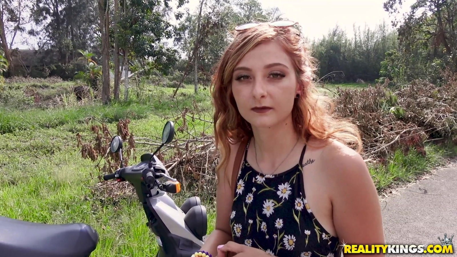 Horny redhead Kadence Marie lifts up her summer dress for a cock