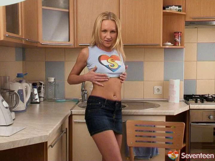 Mouth-watering slutty teen masturbates erotically rubbing her moist muff in the kitchen