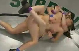 Blonde Harmony gets pounded with a strap-on in a ring