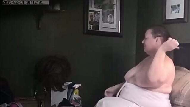 Fuckmeat Fatty Christine combing hair topless