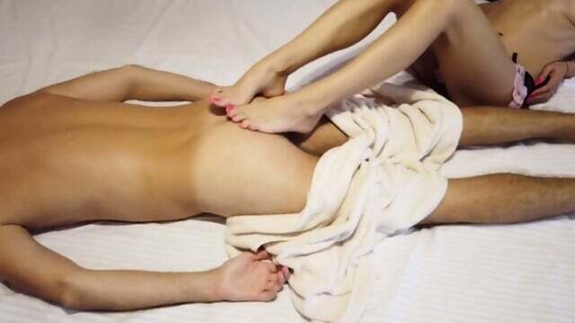 Sexy gives erotic massage, footjob