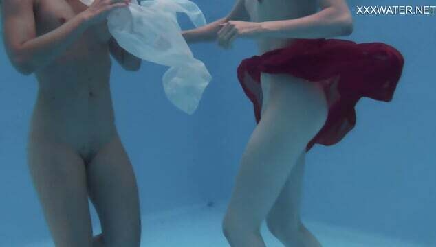 Girlfriends enjoy swimming naked together